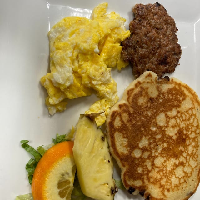 1 Scrambled Egg, 1 Kids Pancake, 1 Piece of Bacon or Sausage.